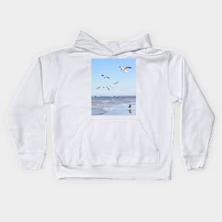 Flock of seagulls flying above the water Kids Hoodie